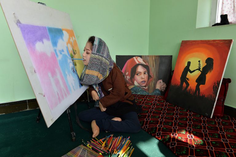 Afghan artist brushes aside disability to open arts centre